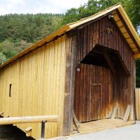 Podul acoperit din Gura Râului, vechi de peste un secol, traversează Cibinul fără a avea niciun picior  de sprijin în apă. A fost restaurat de voluntari
